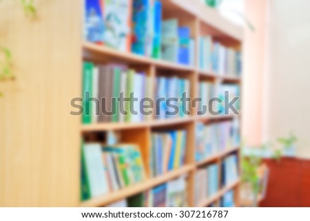 background for design : horizontal blurred library bookshelves