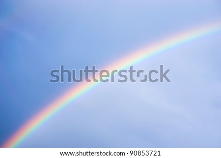 beautiful rainbow in the blue sky after the rain