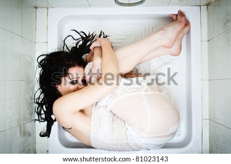 I am scared. Offended stressed and scared woman trying to hide at bath room