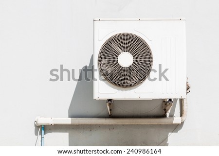 Air conditioning compressor on wall