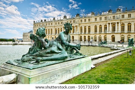sculpture in the garden of chateau de Versailles with blue sky, France (composition)