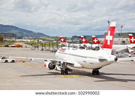 ZURICH - APRIL 22: SWISS\'s commercial air crafts at Zurich airport on April 22, 2012 in Zurich, Switzerland. Swiss International Air Lines (SWISS) was formed  after the 2002 bankruptcy of Swissair.