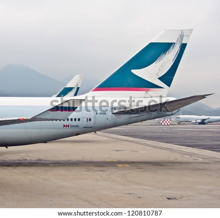 HONG KONG - NOV 26: Cathay Pacific\'s air craft at the airport on Nov 26, 2012. Cathay Pacific is an international flag carrier of Hong Kong which service to 168 destinations in 42 countries worldwide.