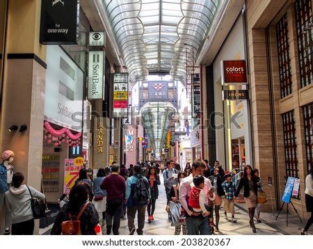 OSAKA -APR 13: Tourists at shopping street in Osaka, Japan on Apr 13, 2014. Osaka is Japan\'s third largest city by population and well know as economic hub of Kansai area.