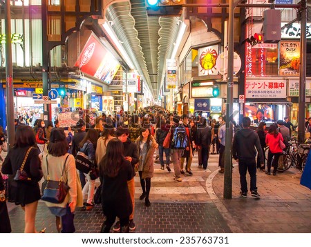 OSAKA -APR 12: Tourists at shopping street in Osaka, Japan on Apr 12, 2014. Osaka is Japan's third largest city by population and well know as economic hub of Kansai area.