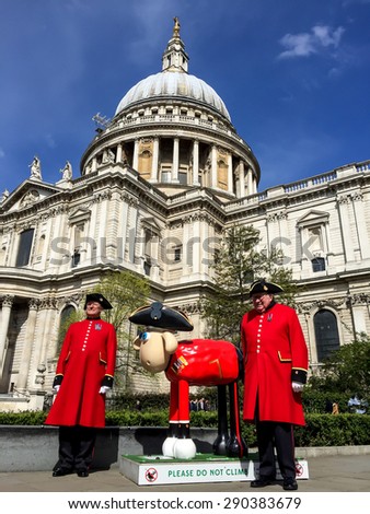LONDON, UK - APR 18, 2015: Shaun the sheep sculpture in front of St Paul cathedral. The sculptures are placed in London's iconic locations, to raise funds for Wallace & Gromitâ??s Childrenâ??s Charity.