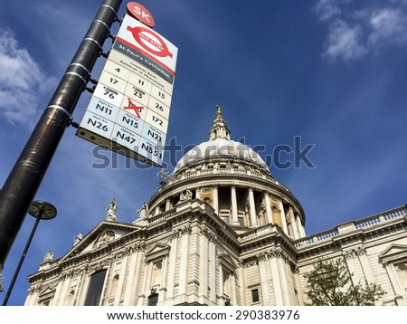 LONDON, UNITED KINGDOM - APRIL 18, 2015: St Pual cathedral with London'd bus stop. London is the world's most-visited city as measured by international arrivals.
