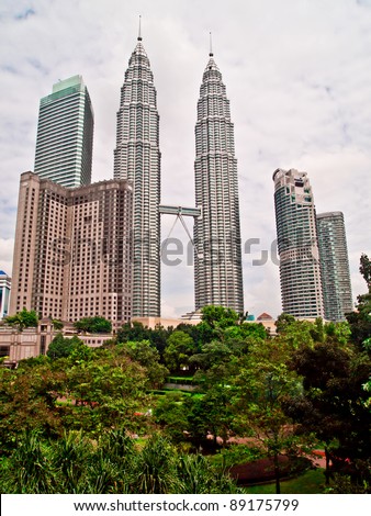 KUALA LUMPUR-NOVEMBER 15: The Petronas Twin Towers and other skyscrapers on November 15 , 2011 in Kuala Lumpur, Malaysia. The Petronas Towers are the tallest twin buildings in the world.