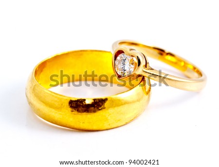 stock photo two gold wedding rings on white background