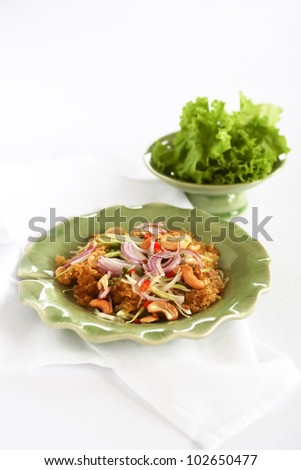Thai food, yam pla duk foo, minced and fried catfish with salad of green papaya.