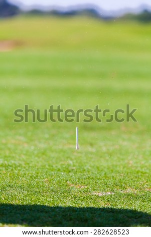 Grass and Tee Splash after Golf Player Hitting ball on golf course