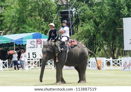 HUA HIN, THAILAND -SEPTEMBER 13: Unidentified polo players play in elephant polo games during the 2012 King \'s Cup Elephant Polo match on September 13, 2012 at Suriyothai Camp in Hua Hin, Thailand
