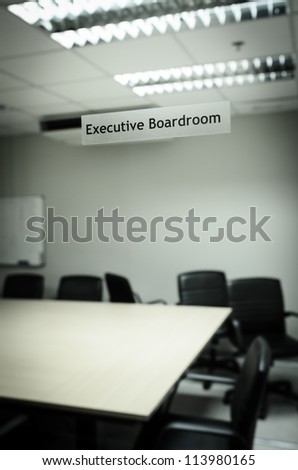 An empty meeting room and conference table, from mirror sticker
