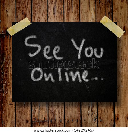 See you online on message note with wooden background