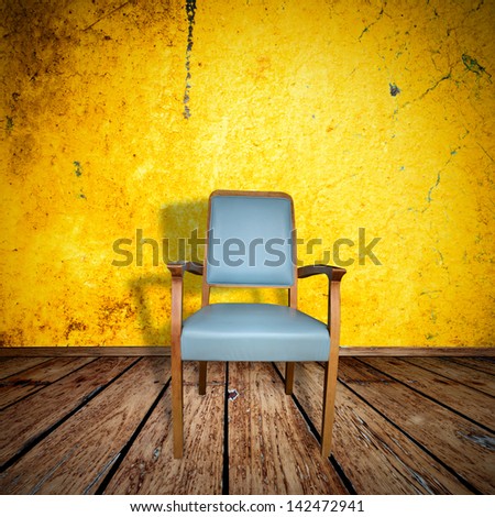 Photo of abstract grunge shabby interior with single chair