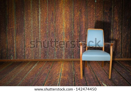 Photo of abstract grunge shabby interior with single chair, copyspace