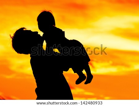 Father hold and kiss baby with love, color of love, Father\'s day concept