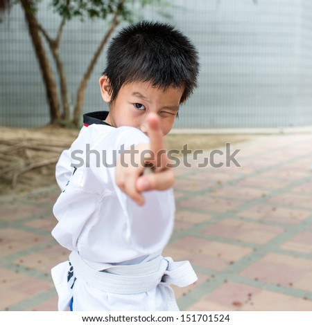 martial arts boy in kimono excercising karate kata