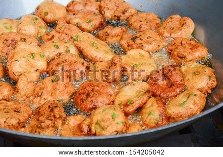 fried fish patty in the pan