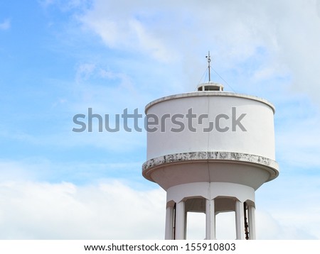 Cement water storage tank with blue sky.