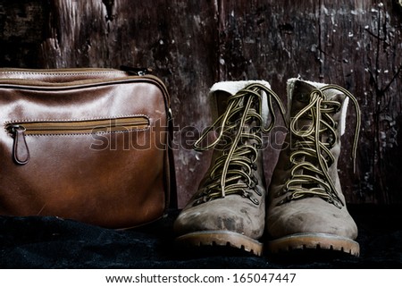 Dirty boots and brown bag, still life
