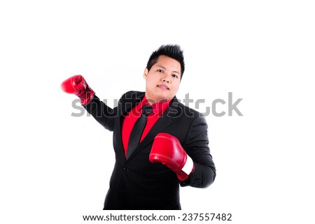 businessman with red boxing glove ready to fight with problem, business concep