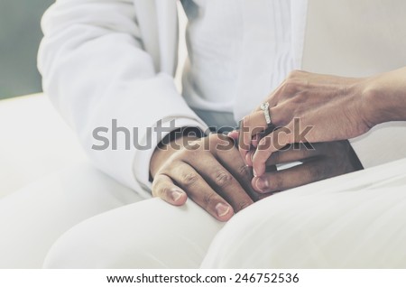 wedding theme, holding hands with love mood and tone.