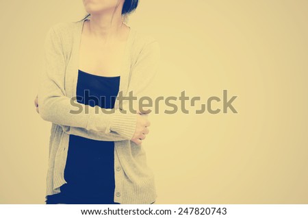 confident woman holding hugging herself, photo filter effect