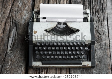 vintage typewriter and telephone , notebook on the wood desk