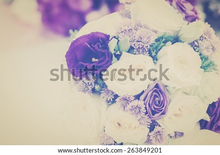 Romantic vintage White and purple roses bouquet on table.