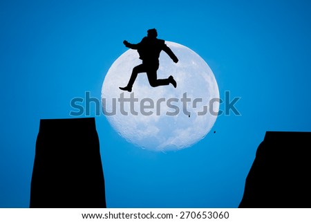 silhouette Man Jumping in sun rise with big moon