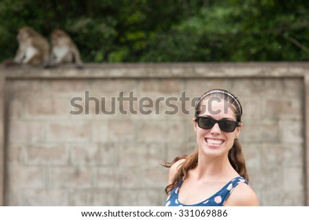 Happy woman smilling with money background.