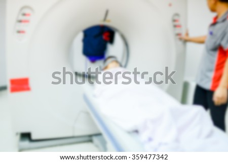 Blurry background examining patient before CT scan
