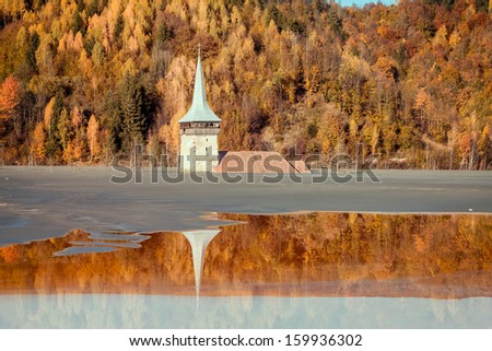 Old flooded church in a mud lake - Natural disaster