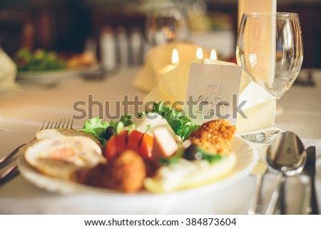 Simple and elegant restaurant table of food. Catering services background with healthy food. Wedding appetizer table.