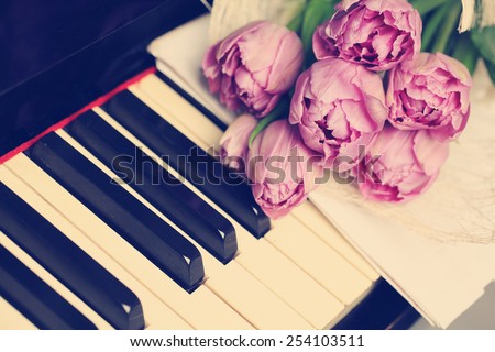 Floral background with flowers and piano keys