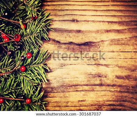 Christmas Background Border. Green Twig of Christmas Tree on Wooden Background