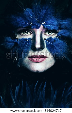 Fantasy Stage Makeup. Woman with Art Makeup. Blue Bird Face