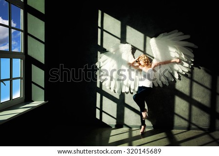 White Angel and Day Light on Black Background
