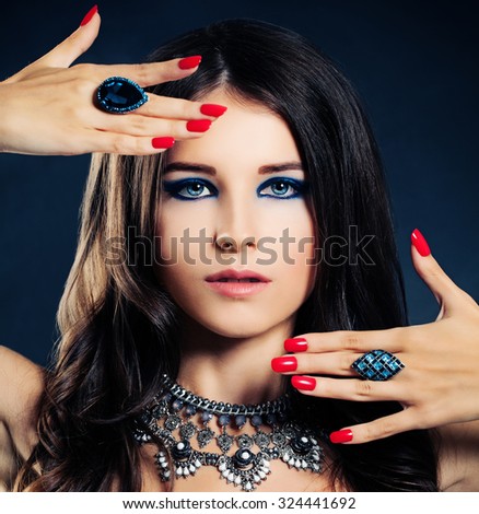 Elegant Brunette Lady. Woman with Makeup, Manicure and Jewelry