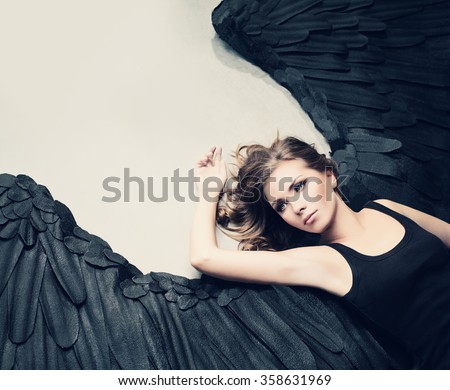 Glamour Woman Fashion Model Black Angel Relaxing