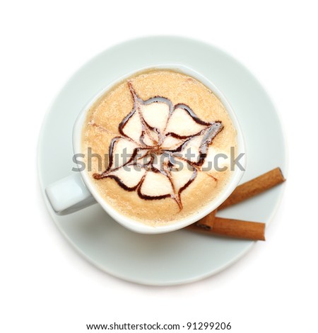 Cappuccino coffee with pattern of chocolate sauce isolated on white