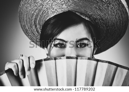 Young japanese woman with fan portrait.