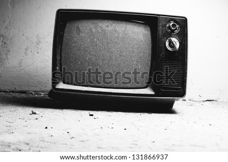 Old TV in room. Black and white film style colors.