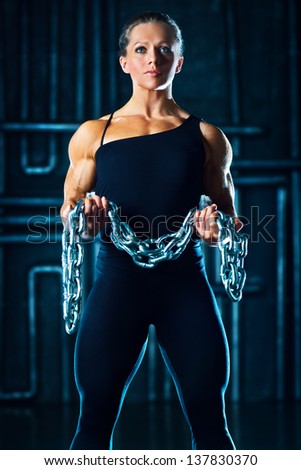 Young sports woman with heavy chain fashion portrait.