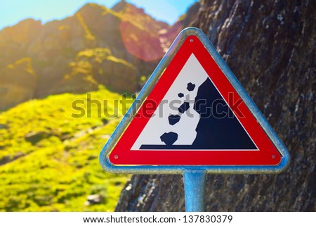 Road sign. Danger falling stones.