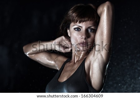 Young strong woman water portrait.