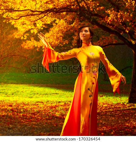 Young vietnamese woman in autumn park.