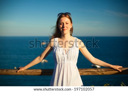 Young woman portrait on sea background.
