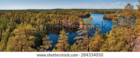 Finland forest and lake autumn panorama.